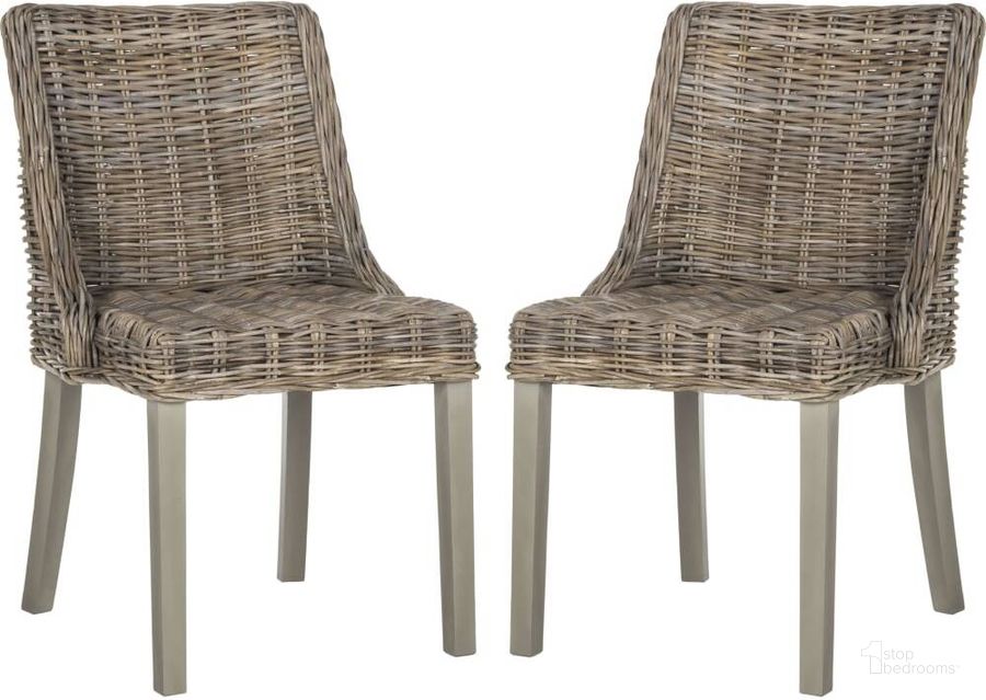 The appearance of Caprice Natural Wicker Dining Chair with Leather Handle designed by Safavieh in the traditional interior design. This grey piece of furniture  was selected by 1StopBedrooms from Safavieh SEA Collection to add a touch of cosiness and style into your home. Sku: SEA7005A-SET2. Product Type: Dining Chair. Material: Rattan. Image1
