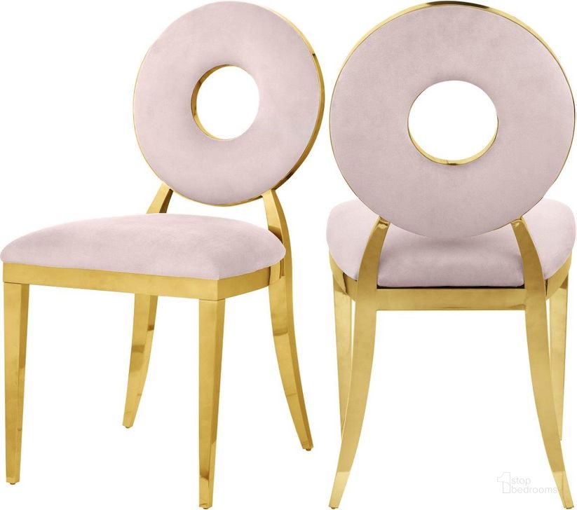 The appearance of Carousel Pink Velvet Dining Chair Set of 2 designed by Meridian in the modern / contemporary interior design. This pink velvet piece of furniture  was selected by 1StopBedrooms from Carousel Collection to add a touch of cosiness and style into your home. Sku: 858Pink-C. Material: Steel. Product Type: Dining Chair. Image1