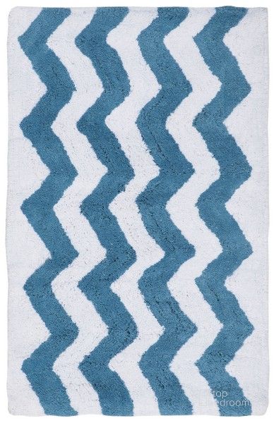 The appearance of Chevron Tufted Bath Mat Set of 2 in Blue PMB727A-2134-SET2 designed by Safavieh in the modern / contemporary interior design. This light blue piece of furniture  was selected by 1StopBedrooms from Chevron Collection to add a touch of cosiness and style into your home. Sku: PMB727A-2134-SET2. Product Type: Rug. Material: Cotton. Image1