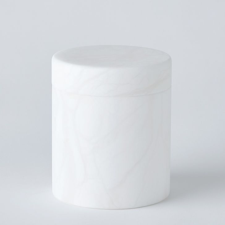 The appearance of Cilindro Alabaster Medium Box In White designed by Global Views in the modern / contemporary interior design. This white piece of furniture  was selected by 1StopBedrooms from Cilindro Collection to add a touch of cosiness and style into your home. Sku: 7.30229. Product Type: Box. Material: Alabaster. Image1