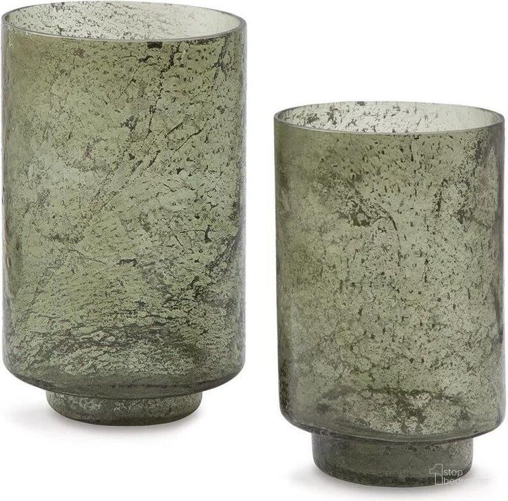 The appearance of Clarkton Candle Holder Set Set of 2 In Green designed by Signature Design by Ashley in the transitional interior design. This green piece of furniture  was selected by 1StopBedrooms from Clarkton Collection to add a touch of cosiness and style into your home. Sku: A2000623. Material: Glass. Product Type: Candle Holder. Image1