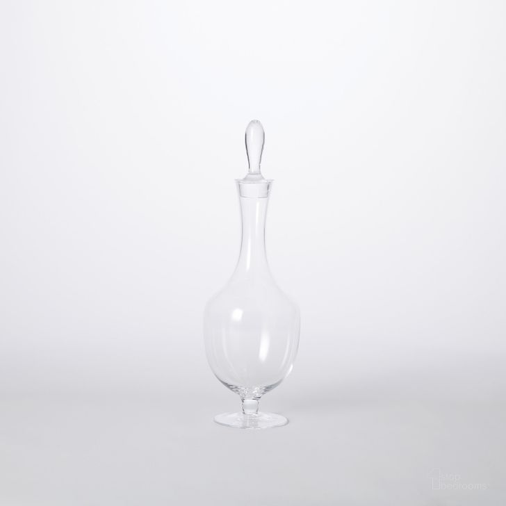 The appearance of Classic Footed Small Decanter In Clear designed by Global Views in the traditional interior design. This clear piece of furniture  was selected by 1StopBedrooms from Classic Collection to add a touch of cosiness and style into your home. Sku: 6.6062. Material: Glass. Product Type: Decorative Accessory. Image1