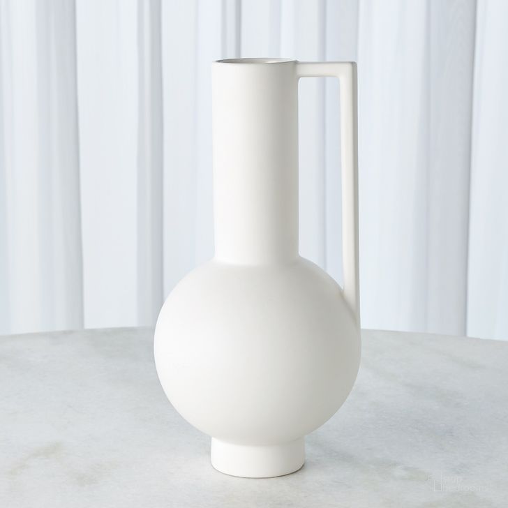 The appearance of Classic Pitcher With Handle In Matte White designed by Global Views in the modern / contemporary interior design. This white piece of furniture  was selected by 1StopBedrooms from Classic Collection to add a touch of cosiness and style into your home. Sku: 1.10779. Material: Ceramic. Product Type: Decorative Accessory. Image1
