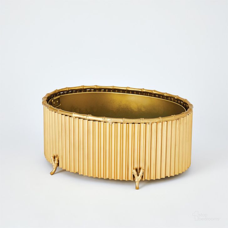 The appearance of Corrugated Bamboo Medium Cachepot In Brass designed by Global Views in the modern / contemporary interior design. This brass piece of furniture  was selected by 1StopBedrooms from Corrugated Collection to add a touch of cosiness and style into your home. Sku: 9.91954. Product Type: Decorative Accessory. Material: Brass. Image1