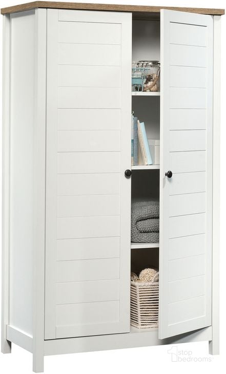 The appearance of Cottage Road Storage Cabinet In Soft White designed by Sauder in the country / farmhouse interior design. This soft white piece of furniture  was selected by 1StopBedrooms from Cottage Road Collection to add a touch of cosiness and style into your home. Sku: 423509. Product Type: Storage Cabinet. Material: Engineered Wood. Image1