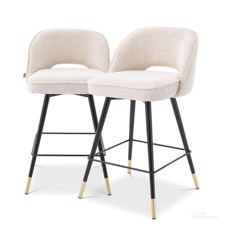 The appearance of Counter Stool In Cliff Boucle Cream Set Of 2 designed by Eichholtz in the modern / contemporary interior design. This cream piece of furniture  was selected by 1StopBedrooms from Cliff Collection to add a touch of cosiness and style into your home. Sku: A114649. Material: Fabric. Product Type: Barstool. Image1
