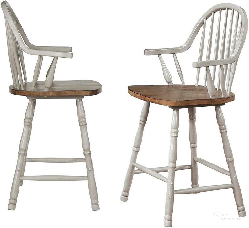 The appearance of Country Grove 24 Inch Windsor Bar and Counter Stool with Arms Set of 2 designed by Sunset Trading in the modern / contemporary interior design. This distressed light gray and medium walnut piece of furniture  was selected by 1StopBedrooms from Country Grove Collection to add a touch of cosiness and style into your home. Sku: DLU-CG-B3024A-GO-2. Material: Wood. Product Type: Home Bar Set. Image1