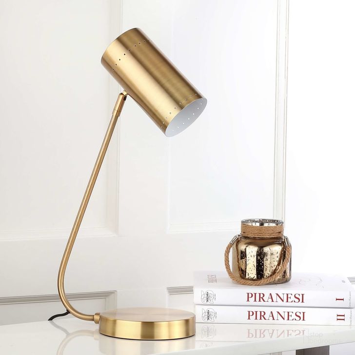 The appearance of Crane Table Lamp designed by Safavieh in the modern / contemporary interior design. This gold piece of furniture  was selected by 1StopBedrooms from Safavieh TBL Collection to add a touch of cosiness and style into your home. Sku: TBL4035A. Product Type: Table Lamp. Image1