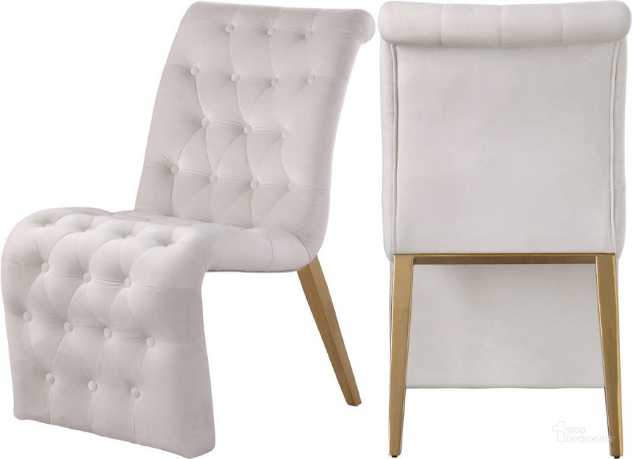 The appearance of Curve Cream Velvet Dining Chair Set of 2 designed by Meridian in the modern / contemporary interior design. This cream velvet piece of furniture  was selected by 1StopBedrooms from Curve Collection to add a touch of cosiness and style into your home. Sku: 920Cream-C. Product Type: Dining Chair. Material: Iron. Image1