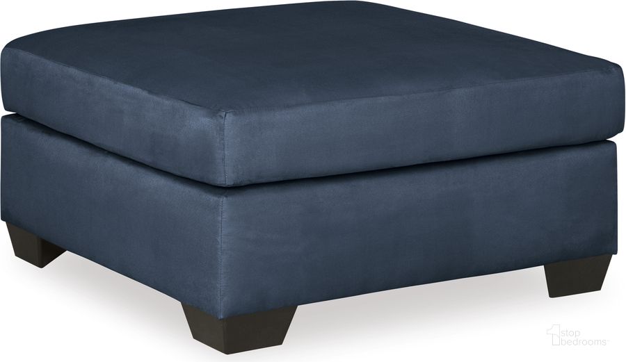 The appearance of Darcy Ottoman In Blue designed by Signature Design by Ashley in the modern / contemporary interior design. This blue piece of furniture  was selected by 1StopBedrooms from Darcy Collection to add a touch of cosiness and style into your home. Sku: 7500714. Material: Fabric. Product Type: Ottoman. Image1