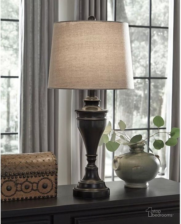 The appearance of Darlita Bronze Metal Table Lamp Set of 2 designed by Signature Design by Ashley in the traditional interior design. This bronze piece of furniture  was selected by 1StopBedrooms from Darlita Collection to add a touch of cosiness and style into your home. Sku: L204024. Material: Fabric. Product Type: Table Lamp. Image1