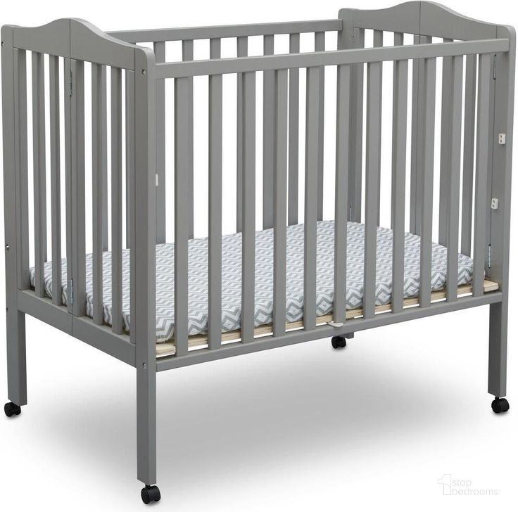 The appearance of Delta Children Folding Portable Mini Baby Crib With 1.5 Inch Mattress With Greenguard Gold Certified In Grey designed by Delta Children in the modern / contemporary interior design. This grey piece of furniture  was selected by 1StopBedrooms from  to add a touch of cosiness and style into your home. Sku: 4470-026. Material: Wood. Product Type: Crib. Image1