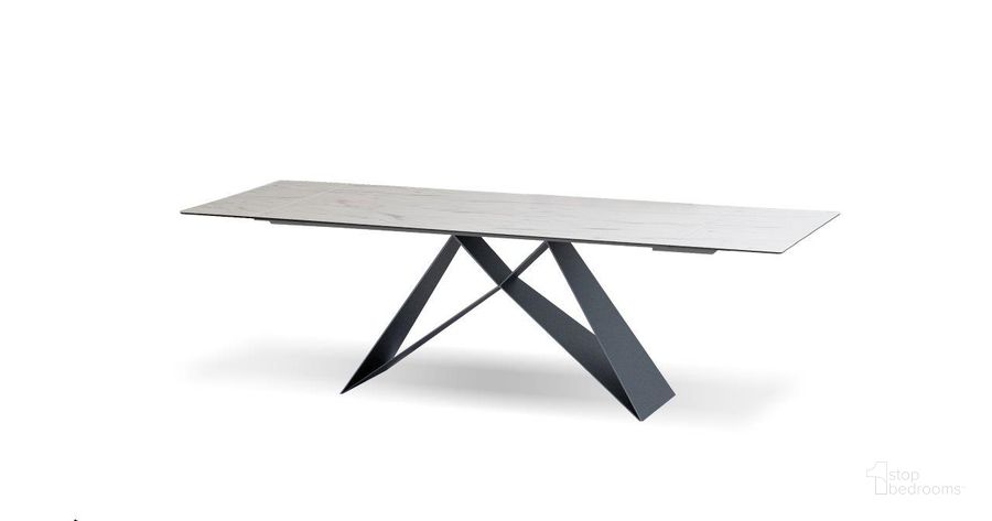The appearance of The W Carerra Ceramic Extension Dining Table With Black Base designed by Mobital in the modern / contemporary interior design. This black piece of furniture  was selected by 1StopBedrooms from The W Collection to add a touch of cosiness and style into your home. Sku: DTA-THEW-CARR-. Table Base Style: Trestle. Material: Metal. Product Type: Dining Table. Table Top Shape: Rectangular. Size: 63". Image1