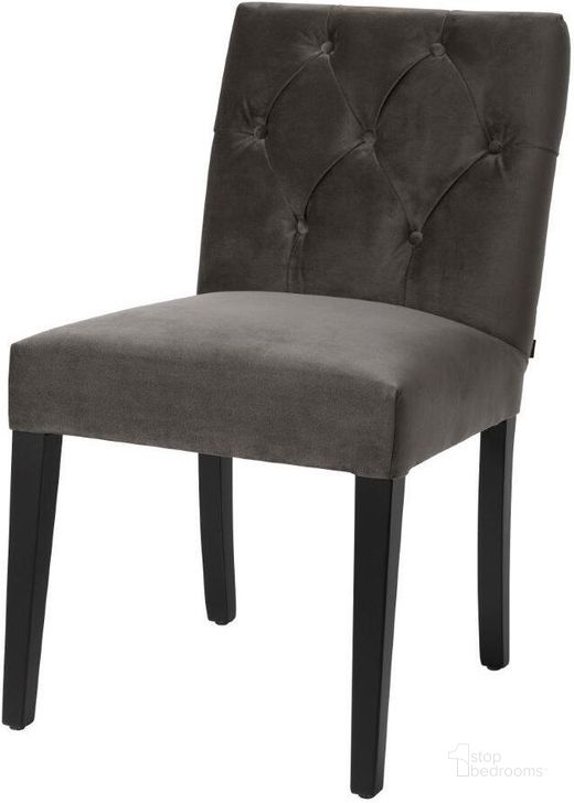 The appearance of Dining Chair Atena Savona Grey Velvet designed by Eichholtz in the modern / contemporary interior design. This grey piece of furniture  was selected by 1StopBedrooms from Atena Collection to add a touch of cosiness and style into your home. Sku: A113947. Product Type: Dining Chair. Material: Velvet. Image1