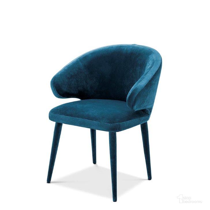 The appearance of Dining Chair Cardinale Roche Teal Blue Velvet designed by Eichholtz in the modern / contemporary interior design. This blue piece of furniture  was selected by 1StopBedrooms from Cardinale Collection to add a touch of cosiness and style into your home. Sku: A112067. Product Type: Dining Chair. Material: Velvet. Image1