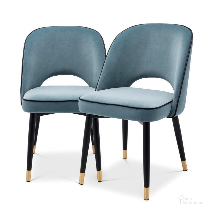 The appearance of Dining Chair Cliff Savona Blue Velvet Set Of 2 designed by Eichholtz in the modern / contemporary interior design. This blue piece of furniture  was selected by 1StopBedrooms from Cliff Collection to add a touch of cosiness and style into your home. Sku: A114301. Material: Leather. Product Type: Dining Chair. Image1