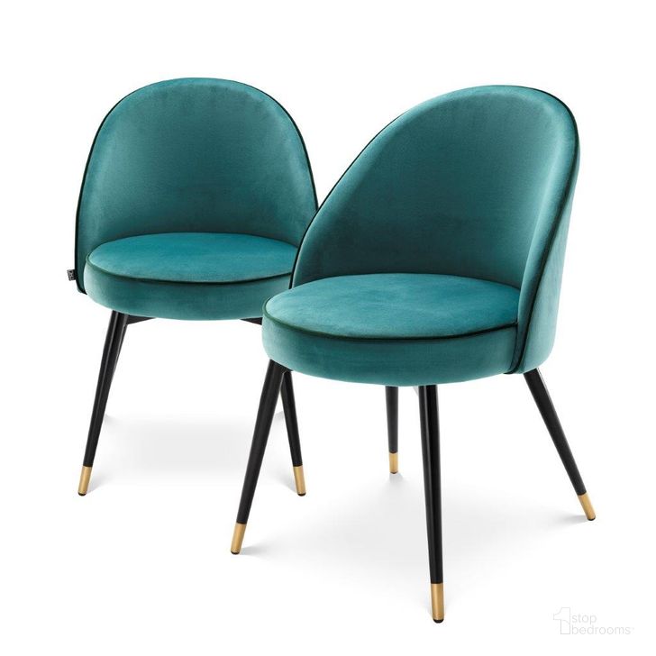 The appearance of Dining Chair Cooper Roche Turquoise Velvet Set Of 2 designed by Eichholtz in the modern / contemporary interior design. This turquoise piece of furniture  was selected by 1StopBedrooms from Cooper Collection to add a touch of cosiness and style into your home. Sku: A113123. Product Type: Dining Chair. Material: Velvet. Image1