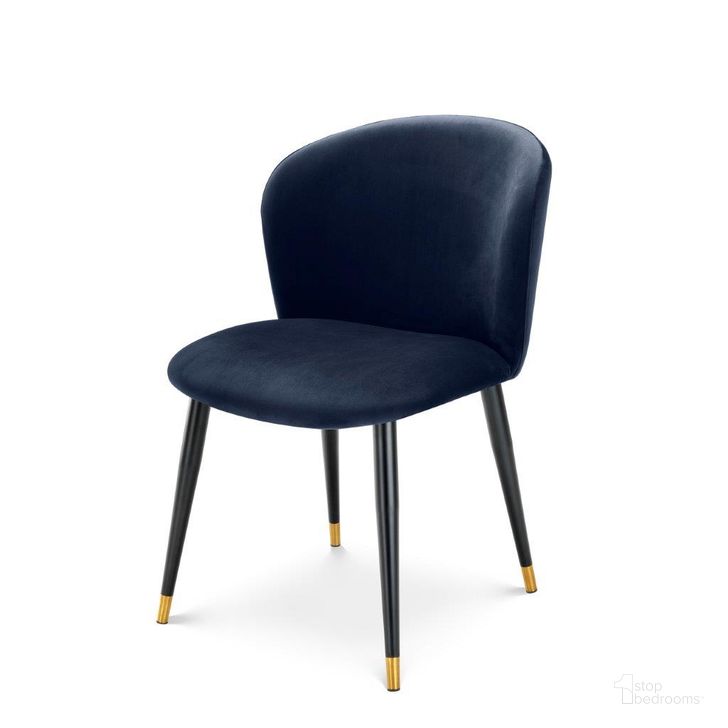 The appearance of Dining Chair Volante Savona Midnight Blue Velvet designed by Eichholtz in the modern / contemporary interior design. This blue piece of furniture  was selected by 1StopBedrooms from Volante Collection to add a touch of cosiness and style into your home. Sku: A113114;A113117. Product Type: Dining Chair. Image1