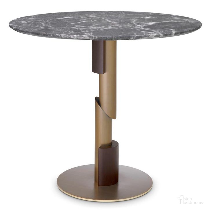The appearance of Dining Table Flow Brushed Brass Grey Marble designed by Eichholtz in the modern / contemporary interior design. This grey piece of furniture  was selected by 1StopBedrooms from Flow Collection to add a touch of cosiness and style into your home. Sku: 116301;116302;116303. Table Base Style: Pedestal. Table Top Shape: Round. Product Type: Dining Table. Size: 34". Image1