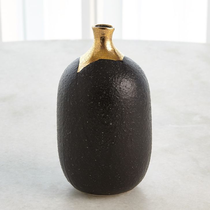 The appearance of Dipped Golden Crackle And Black Cylinder Small Vase designed by Global Views in the modern / contemporary interior design. This black piece of furniture  was selected by 1StopBedrooms from Dipped Collection to add a touch of cosiness and style into your home. Sku: 3.31641. Material: Ceramic. Product Type: Vase. Image1