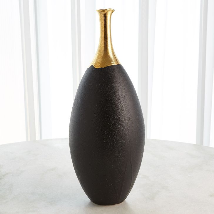 The appearance of Dipped Golden Crackle And Black Slender Large Vase In Black designed by Global Views in the modern / contemporary interior design. This black piece of furniture  was selected by 1StopBedrooms from Dipped Collection to add a touch of cosiness and style into your home. Sku: 3.31638. Material: Ceramic. Product Type: Vase. Image1