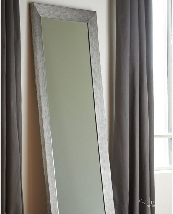 The appearance of Duka Silver 78" Accent Mirror designed by Signature Design by Ashley in the modern / contemporary interior design. This silver piece of furniture  was selected by 1StopBedrooms from Duka Collection to add a touch of cosiness and style into your home. Sku: A8010081. Material: Glass. Product Type: Accent Mirror. Image1