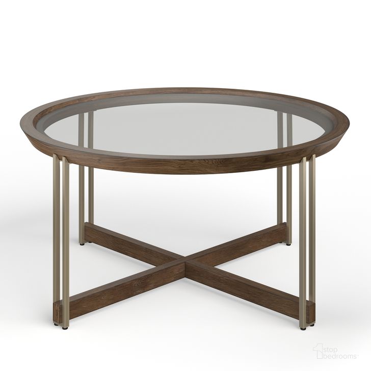 The appearance of Elora Round Cocktail Table designed by Magnussen in the  interior design. This  piece of furniture  was selected by 1StopBedrooms from Elora Collection to add a touch of cosiness and style into your home. Sku: T5639-45. Material: Wood. Product Type: Cocktail Table.