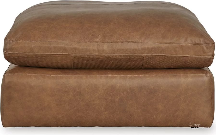 The appearance of Emilia Oversized Accent Ottoman In Caramel designed by Signature Design by Ashley in the modern / contemporary interior design. This caramel piece of furniture  was selected by 1StopBedrooms from Emilia Collection to add a touch of cosiness and style into your home. Sku: 3090108. Product Type: Ottoman. Material: Leather Match. Image1