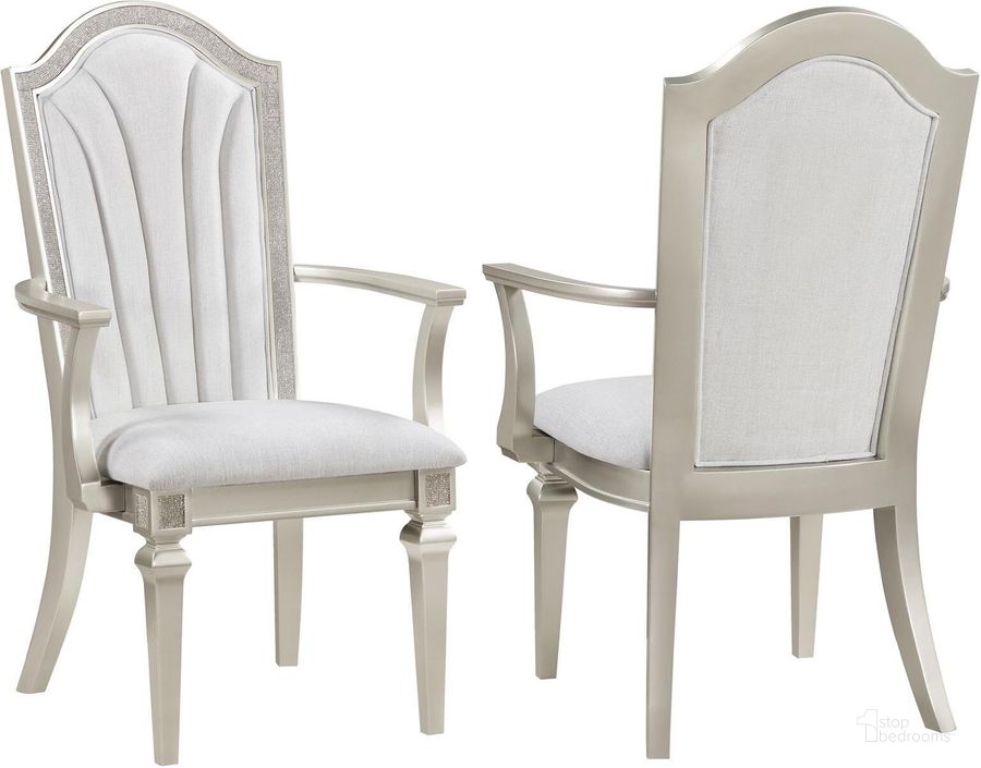 The appearance of Evangeline Upholstered Dining Arm Chair with Faux Diamond Trim Set of 2 In Ivory and Silver Oak designed by Coaster in the glam interior design. This ivory and silver piece of furniture  was selected by 1StopBedrooms from Evangeline Collection to add a touch of cosiness and style into your home. Sku: 107553. Material: Wood. Product Type: Arm Chair. Image1