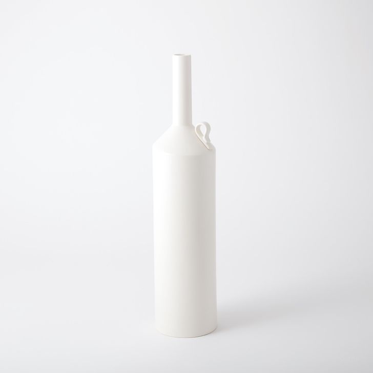 The appearance of Extra Large Metro Bottle In Matte White designed by Global Views in the modern / contemporary interior design. This white piece of furniture  was selected by 1StopBedrooms from Metro Bottle Collection to add a touch of cosiness and style into your home. Sku: 7.10253. Material: Ceramic. Product Type: Decorative Accessory. Image1