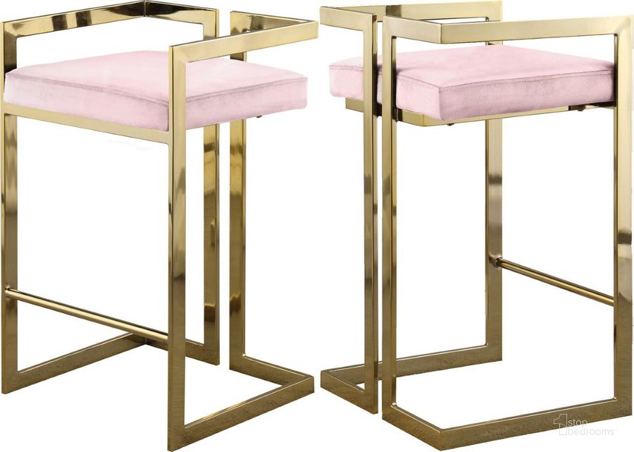 The appearance of Ezra Pink Velvet Stool Set of 2 designed by Meridian in the modern / contemporary interior design. This pink velvet piece of furniture  was selected by 1StopBedrooms from Ezra Collection to add a touch of cosiness and style into your home. Sku: 912Pink-C. Product Type: Barstool. Material: Velvet. Image1