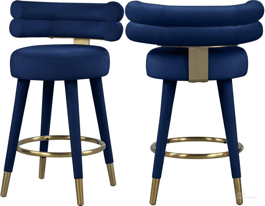 The appearance of Fitzroy Navy Velvet Counter Stool Set of 2 designed by Meridian in the modern / contemporary interior design. This navy velvet piece of furniture  was selected by 1StopBedrooms from Fitzroy Collection to add a touch of cosiness and style into your home. Sku: 798Navy-C. Product Type: Barstool. Material: Iron. Image1
