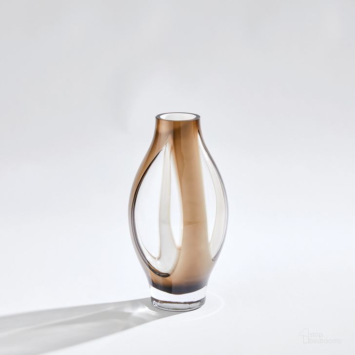 The appearance of Fly Through Small Vase In Topaz designed by Global Views in the modern / contemporary interior design. This clear piece of furniture  was selected by 1StopBedrooms from Fly Collection to add a touch of cosiness and style into your home. Sku: 7.60202. Material: Glass. Product Type: Vase. Image1