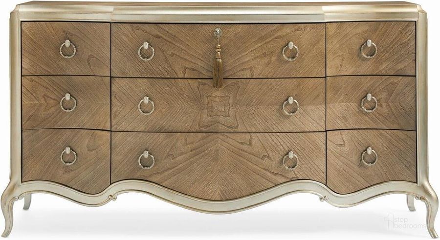 The appearance of Caracole Compositions Fontainebleau Triple Dresser designed by Caracole in the modern / contemporary interior design. This beige piece of furniture  was selected by 1StopBedrooms from Fontainebleau Collection to add a touch of cosiness and style into your home. Sku: C063-419-032. Material: Wood. Product Type: Dresser. Image1