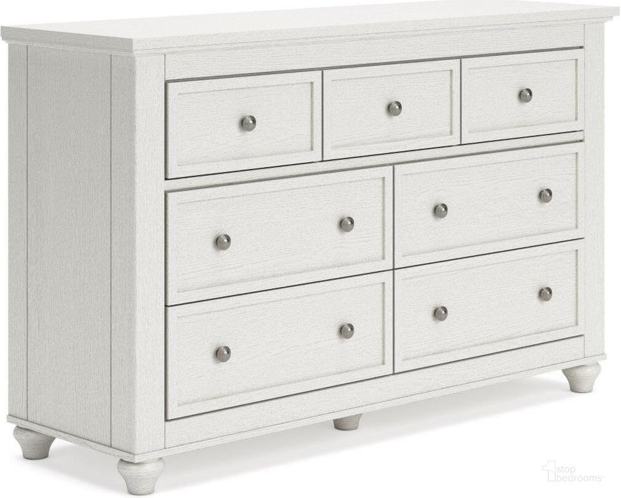 The appearance of Grantoni White Seven Drawer Dresser designed by Signature Design by Ashley in the traditional interior design. This white piece of furniture  was selected by 1StopBedrooms from Grantoni Collection to add a touch of cosiness and style into your home. Sku: B3290-231. Material: Wood. Product Type: Dresser. Image1
