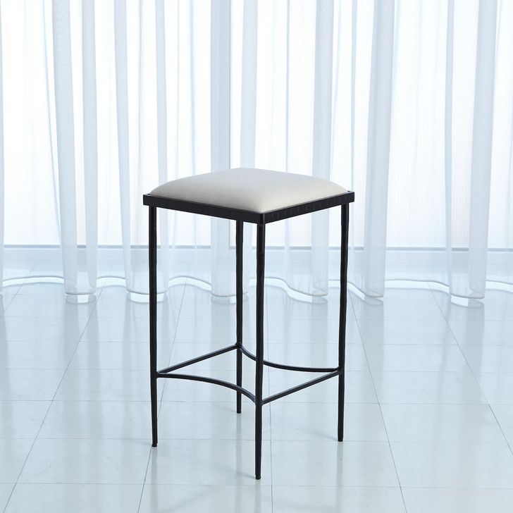The appearance of Hammered Counter Stool In Black designed by Global Views in the modern / contemporary interior design. This black piece of furniture  was selected by 1StopBedrooms from Hammered Collection to add a touch of cosiness and style into your home. Sku: 9.92338. Product Type: Barstool. Material: Iron. Image1