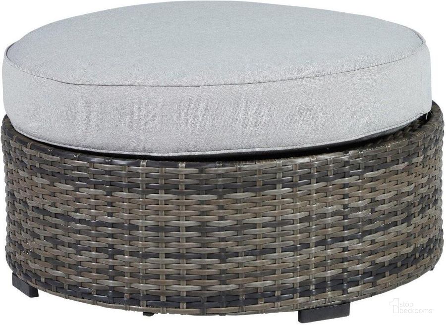 The appearance of Harbor Court Gray Outdoor Ottoman designed by Signature Design by Ashley in the transitional interior design. This gray piece of furniture  was selected by 1StopBedrooms from Harbor Court Collection to add a touch of cosiness and style into your home. Sku: P459-814. Product Type: Outdoor Ottoman. Image1