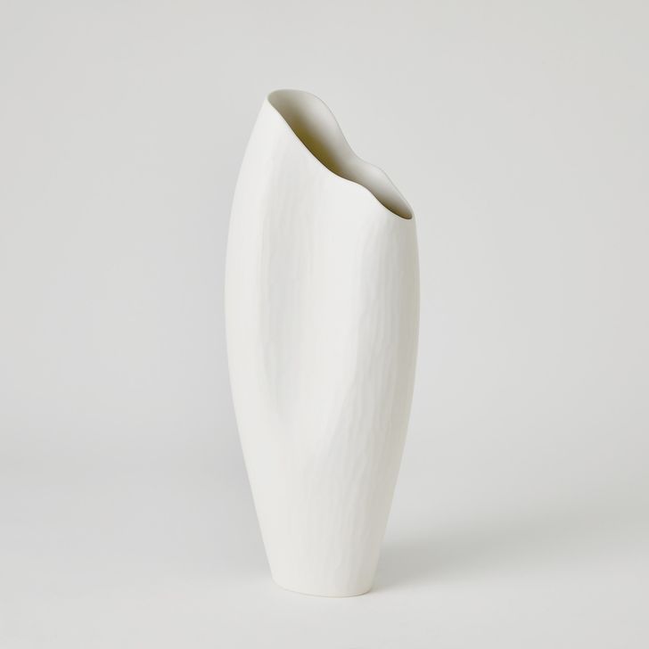 The appearance of Horn Large Vase In Matte White designed by Global Views in the modern / contemporary interior design. This white piece of furniture  was selected by 1StopBedrooms from Horn Collection to add a touch of cosiness and style into your home. Sku: 1.10886. Material: Ceramic. Product Type: Vase. Image1