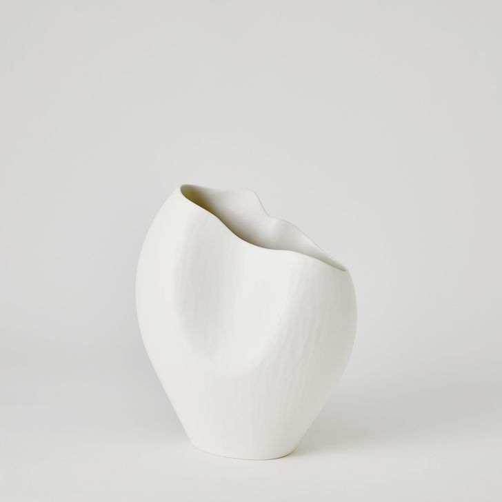 The appearance of Horn Small Vase In Matte White designed by Global Views in the modern / contemporary interior design. This white piece of furniture  was selected by 1StopBedrooms from Horn Collection to add a touch of cosiness and style into your home. Sku: 1.10887. Material: Ceramic. Product Type: Vase. Image1