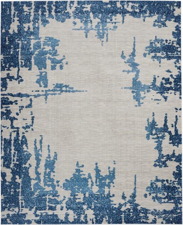 The appearance of Imprints Ivory And Blue 8 X 10 Area Rug designed by Nourison in the modern / contemporary interior design. This ivory and blue piece of furniture  was selected by 1StopBedrooms from Imprints Collection to add a touch of cosiness and style into your home. Sku: 99446718747. Material: Polypropylene. Product Type: Area Rugs. Image1