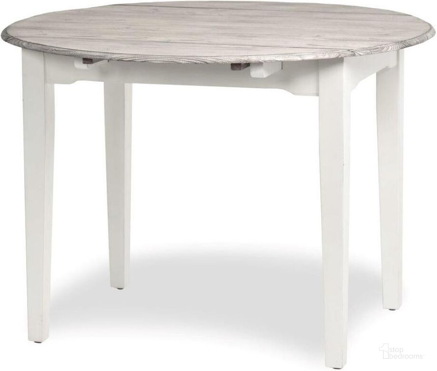 The appearance of Islamorada Butterfly Dining Table In Grey And Taupe designed by Sea Winds Trading in the  interior design. This taupe and grey piece of furniture  was selected by 1StopBedrooms from  to add a touch of cosiness and style into your home. Sku: D23386-DAPGREY. Table Base Style: Legs. Table Top Shape: Round. Material: Wood. Product Type: Dining Table. Size: 42". Image1