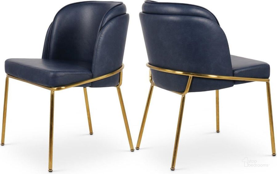 The appearance of Jagger Navy Faux Leather Dining Chair Set of 2 designed by Meridian in the modern / contemporary interior design. This navy piece of furniture  was selected by 1StopBedrooms from Jagger Collection to add a touch of cosiness and style into your home. Sku: 882Navy-C. Product Type: Dining Chair. Material: Iron. Image1