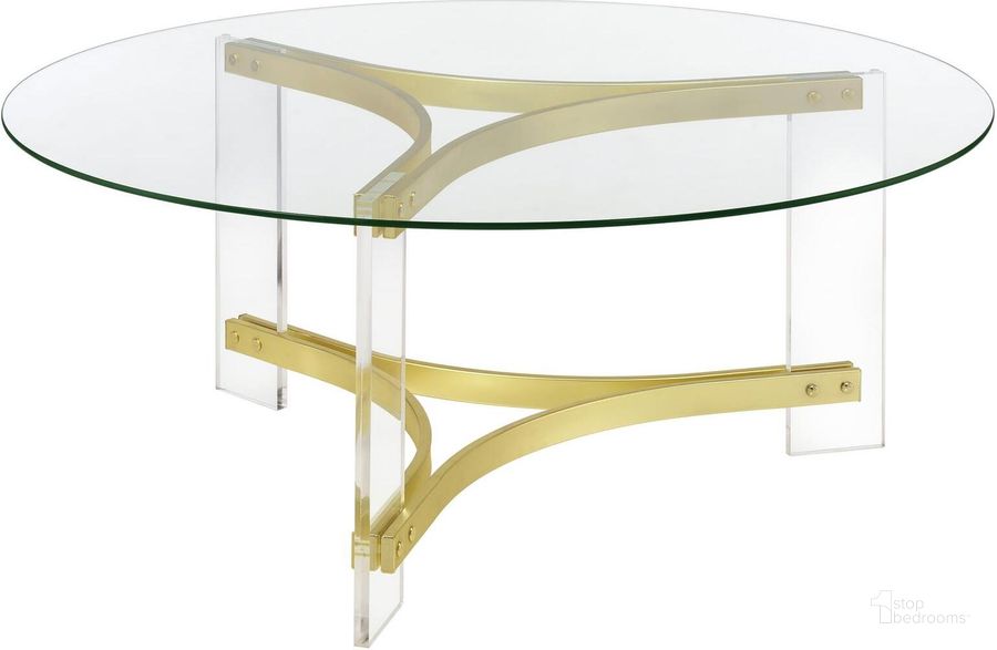 The appearance of Janessa Round Glass Top Coffee Table with Acrylic Legs In Clear and Matte Brass designed by Coaster in the modern / contemporary interior design. This clear/matte brass piece of furniture  was selected by 1StopBedrooms from Janessa Collection to add a touch of cosiness and style into your home. Sku: 710068. Product Type: Coffee Table. Material: Acrylic. Image1