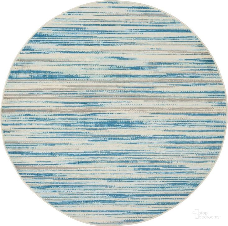 The appearance of Jubilant Blue 5 Round Area Rug designed by Nourison in the modern / contemporary interior design. This blue piece of furniture  was selected by 1StopBedrooms from Jubilant Collection to add a touch of cosiness and style into your home. Sku: 99446478023. Material: Polypropylene. Product Type: Area Rugs. Image1