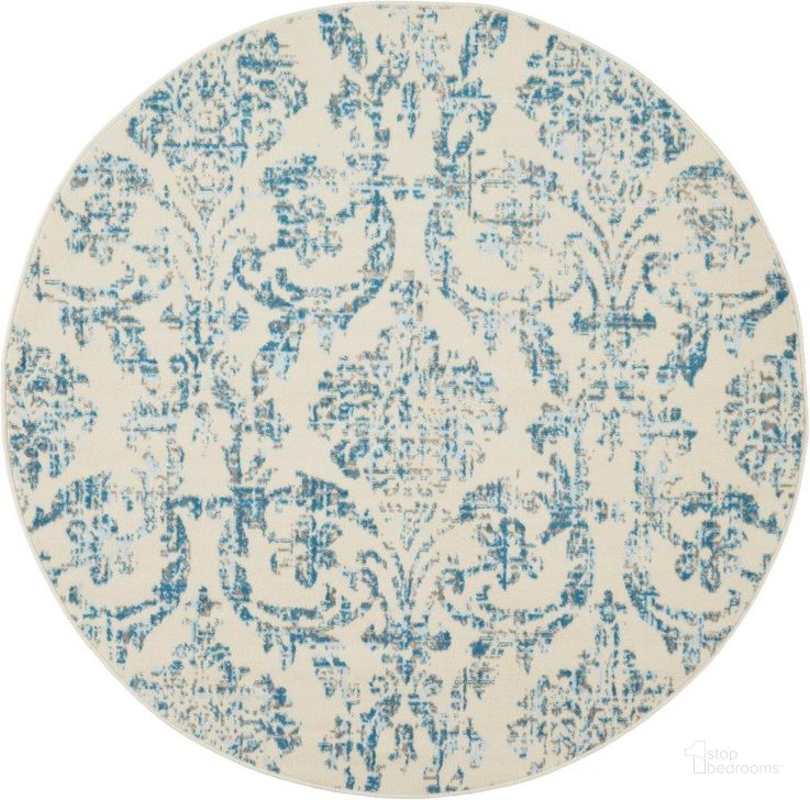 The appearance of Jubilant Ivory And Blue 5 Round Area Rug designed by Nourison in the transitional interior design. This ivory and blue piece of furniture  was selected by 1StopBedrooms from Jubilant Collection to add a touch of cosiness and style into your home. Sku: 99446478771. Material: Polypropylene. Product Type: Area Rugs. Image1