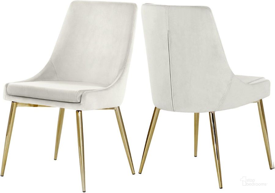 The appearance of Karina Cream Velvet Dining Chair Set of 2 designed by Meridian in the modern / contemporary interior design. This cream velvet piece of furniture  was selected by 1StopBedrooms from Karina Collection to add a touch of cosiness and style into your home. Sku: 783Cream-C. Product Type: Dining Chair. Material: Velvet. Image1