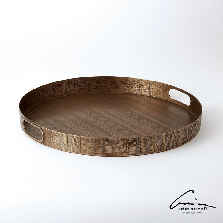 The appearance of Kokoro Etched Round Tray In Brass designed by Global Views in the modern / contemporary interior design. This brass piece of furniture  was selected by 1StopBedrooms from Kokoro Collection to add a touch of cosiness and style into your home. Sku: AS7.90018. Product Type: Tray. Material: Iron. Image1