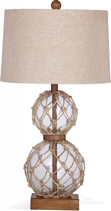The appearance of Seaside Table Lamp designed by Bassett Mirror Company in the modern / contemporary interior design. This beige piece of furniture  was selected by 1StopBedrooms from Seaside Collection to add a touch of cosiness and style into your home. Sku: L3107TEC. Material: Glass. Product Type: Table Lamp.