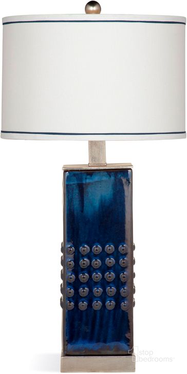 The appearance of Trade Blue Andrews Table Lamp designed by Bassett Mirror Company in the modern / contemporary interior design. This blue piece of furniture  was selected by 1StopBedrooms from Trade Collection to add a touch of cosiness and style into your home. Sku: L3216TEC. Product Type: Table Lamp. Image1