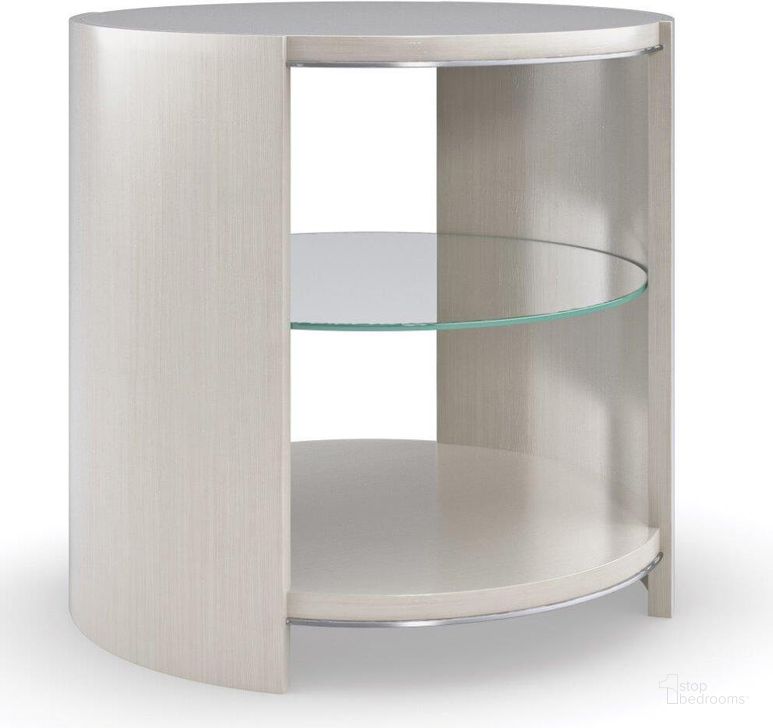 The appearance of Caracole Modern La Moda Da Vita Round End Table designed by Caracole in the transitional interior design. This gray piece of furniture  was selected by 1StopBedrooms from La Moda Collection to add a touch of cosiness and style into your home. Sku: M131-421-412. Material: Wood. Product Type: End Table. Image1